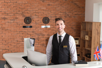 Sticker - Portrait of male receptionist in hotel