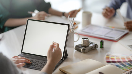 Wall Mural - cropped shot of female application developer working on blank screen tablet