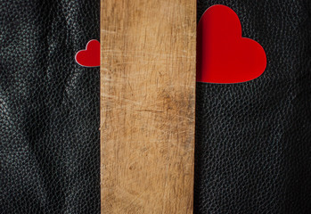 Valentine's Day card. Two red hearts on wooden background. Greeting card concept. Top view