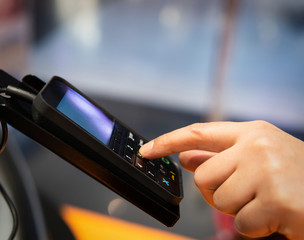 Wall Mural - person entering the password by shopping with a credit card