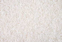 Top View Of White Rice Seed Texture Background. Organic, Natural Long Rice Grain, Food For Healthy. Agriculture Of Culture Asian. Flay Lay