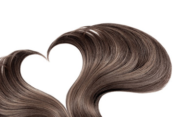 Brown hair in shape of heart on white, isolated