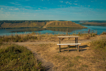 Wall Mural - national park spring time scenery landscape top view point on water reservoir and hill land camp place with table and bench