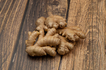 Ginger.Ginger root on a wooden background. Vegetarianism.