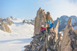 Positive femele mountain climbers having a break on Aiguille d'Entreves mountain ridge
