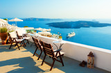 Fototapeta Do akwarium - Santorini island, Greece. Beautiful terrace with sea view. Travel destinations concept