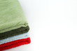 stack of folded clean towels on white background with copy space