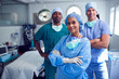 © Monkey Business - Portrait Of Multi-Cultural Surgical Team Standing In Hospital Operating Theater