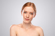 © kegfire - Pretty freckled woman looking at camera