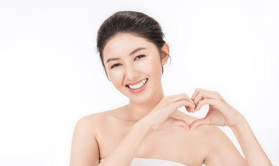 Closeup portrait of beauty asian woman clear healthy perfect skin hands gesture heart, asian beautiful Korean girl smile face. Beauty clinic glow makeup facial spa skincare, valentines concept