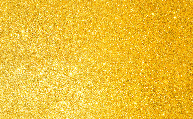 Wall Mural - sparkles of golden glitter texture background