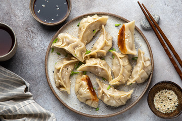 Wall Mural - Traditional japaneese gyoza dumplings with meat and mushrooms on ceramic plate