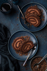 Sticker - delicious chocolate roll cake with chocolate cream on blue plate