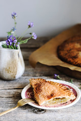 Wall Mural - Homemade rhubarb pie on vintage wooden table. Simple summer pie. Ready to eat. Selective focus