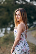 © blackbirdua - Portrait of young attractive chestnut beautiful woman on green forest background in fresh summer dress