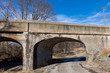 Old rural railroad bridge with crumbling, cracking concrete. Concept of deterioration transportation infrastructure in the United States of America