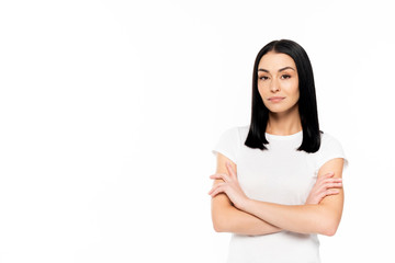 Wall Mural - attractive woman standing with crossed arms isolated on white