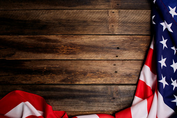 Wall Mural - American flag on old brown wooden table