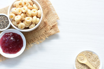 Quinoa cereal, accompanied by seeds and honey