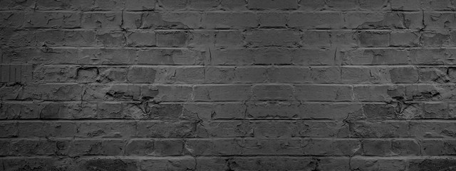 Dark black anthracite damaged rustic brick wall texture banner panorama