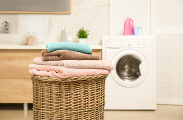 Sticker - Wicker basket with laundry and washing machine in bathroom