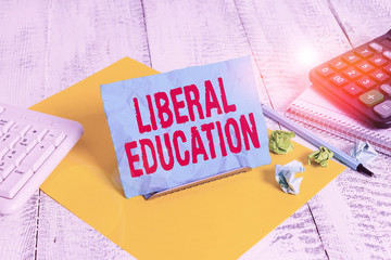 Wall Mural - Text sign showing Liberal Education. Business photo text education suitable for cultivation of free huanalysis being Notepaper stand on buffer wire in between computer keyboard and math sheets