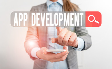 Writing note showing App Development. Business concept for the act or process by which a mobile app is developed Business concept with mobile phone and business woman