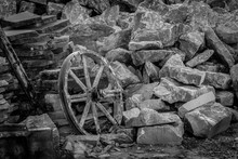 Old Wooden Cart Wheel In Stone Quarry