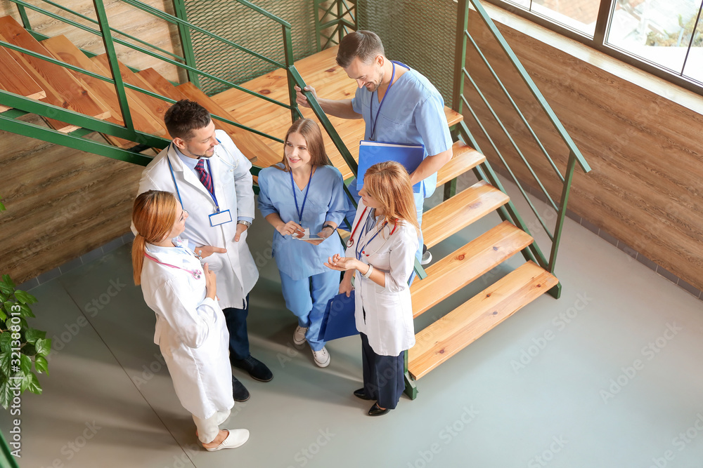 Doctors discussing something in hall of clinic