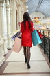 elegant woman is enjoying shopping close up in a luxury mall