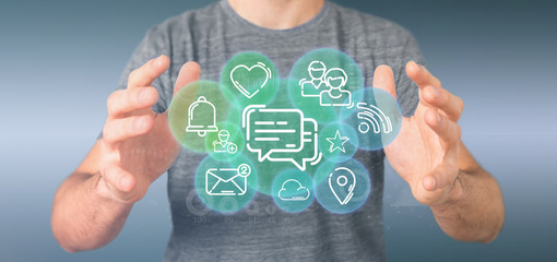 businessman holding a cloud of social media network icon