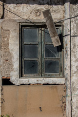 Wall Mural - old wooden window of a warehouse or barn, wood texture or background, wooden planks on a rural barn window, vintage old warehouse wooden window