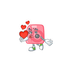 Sticker - A sweetie instan camera cartoon character holding a heart