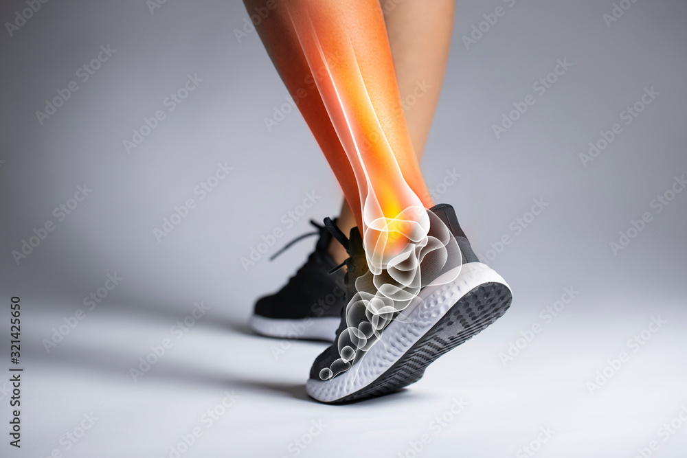 Ankle pain in detail - Sports injuries concept. - obrazy, fototapety, plakaty 