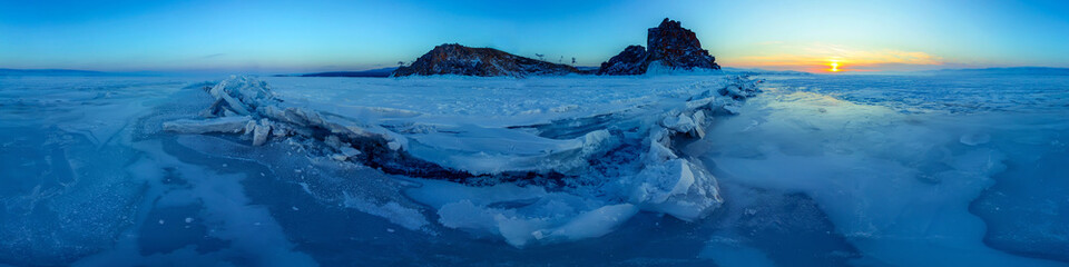 Wall Mural - Big cracks in the ice of Lake Baikal at the Shaman Rock on Olkhon Island. .Cylindrical panorama 360