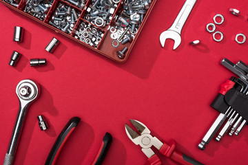 Wall Mural - Frame of tool set with wrenches and hex keys on red background