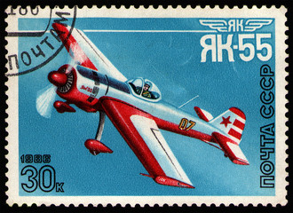 Wall Mural - USSR - CIRCA 1986: post stamp 30 Soviet kopek printed by USSR, shows Yakovlev Yak-55, a single-seat aerobatic aircraft. Pilots flying Yak-55 have won several world aerobatic championships, circa 1986