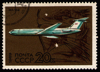 Wall Mural - USSR - CIRCA 1969: post stamp 20 Soviet kopek printed by USSR, shows Ilyushin IL-62 (NATO reporting name: Classic), Soviet jetliner, world's largest jet airliner when first flown in 1963, circa 1969