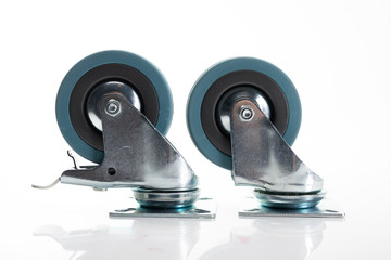 Heavy duty metal caster wheels with mounting plate, isolated on a white background.