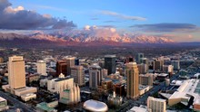 Salt Lake City Utah Skyline At Sunset With Mountains Aerial Drone