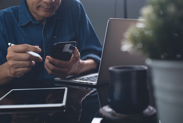 Multitasking business man working in office