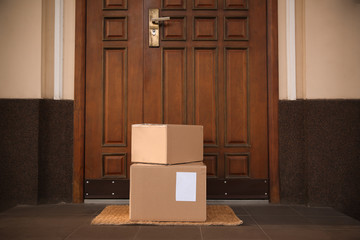 Wall Mural - Delivered parcels on door mat near entrance