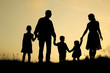 © Kostia - silhouette of a happy family with children