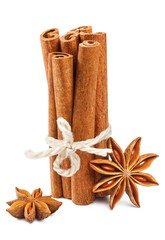 Delicious cinnamon sticks and star anise, isolated on white background