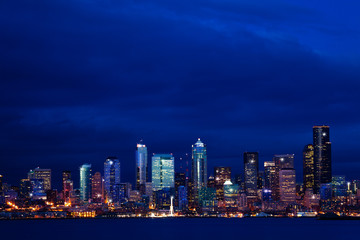 Wall Mural - Panorama of Seattle city night downtown view skyline over Elliot bay, WA, USA