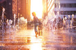 © Sergey Novikov - Child run and play on street fountain on Philadelphia square over sunset near city hall in downtown