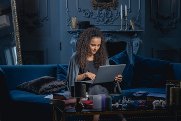 pleased pretty girl typing on a laptop