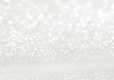 Fototapeta Natura - White texture background with glitter sparkles. Festive glitter background.