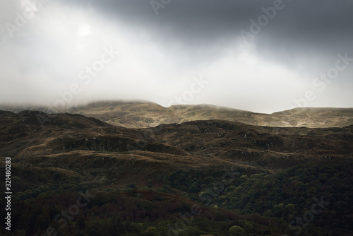 Cuadros en Lienzo Panoramic view of the rocky shores of Kyles of Bute from the water
