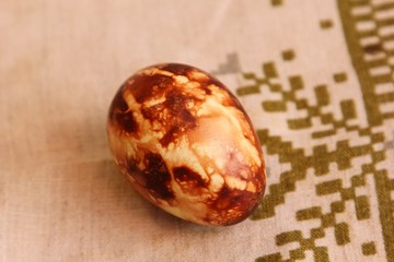 Yellow and brown Easter eggs painted in natural onion bark. Easter egg in old traditional latvian style